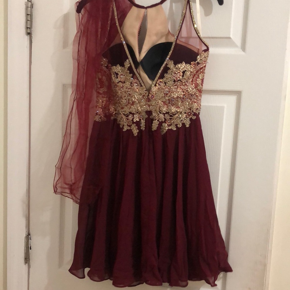 This Dress is perfect for a prom, size Small, Is a Wine color, only used once.